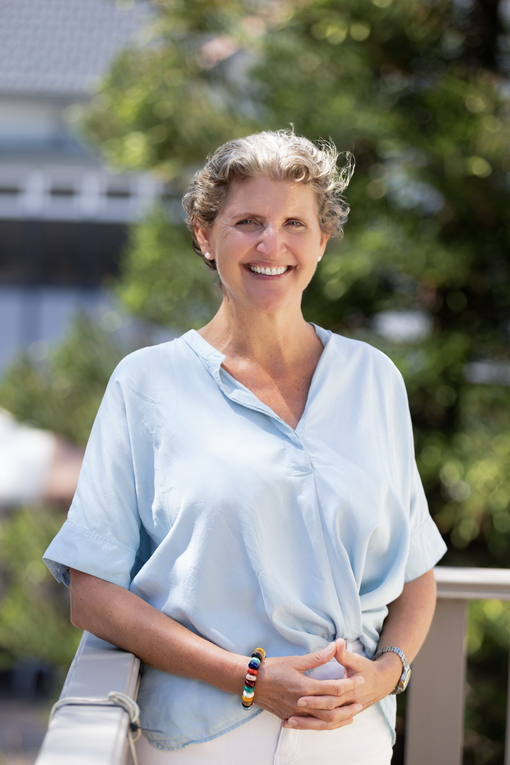 Dr Caroline Rogers, menopause doctor in Manly, standing outside South Steyne Medical Centre on the Northern Beaches.