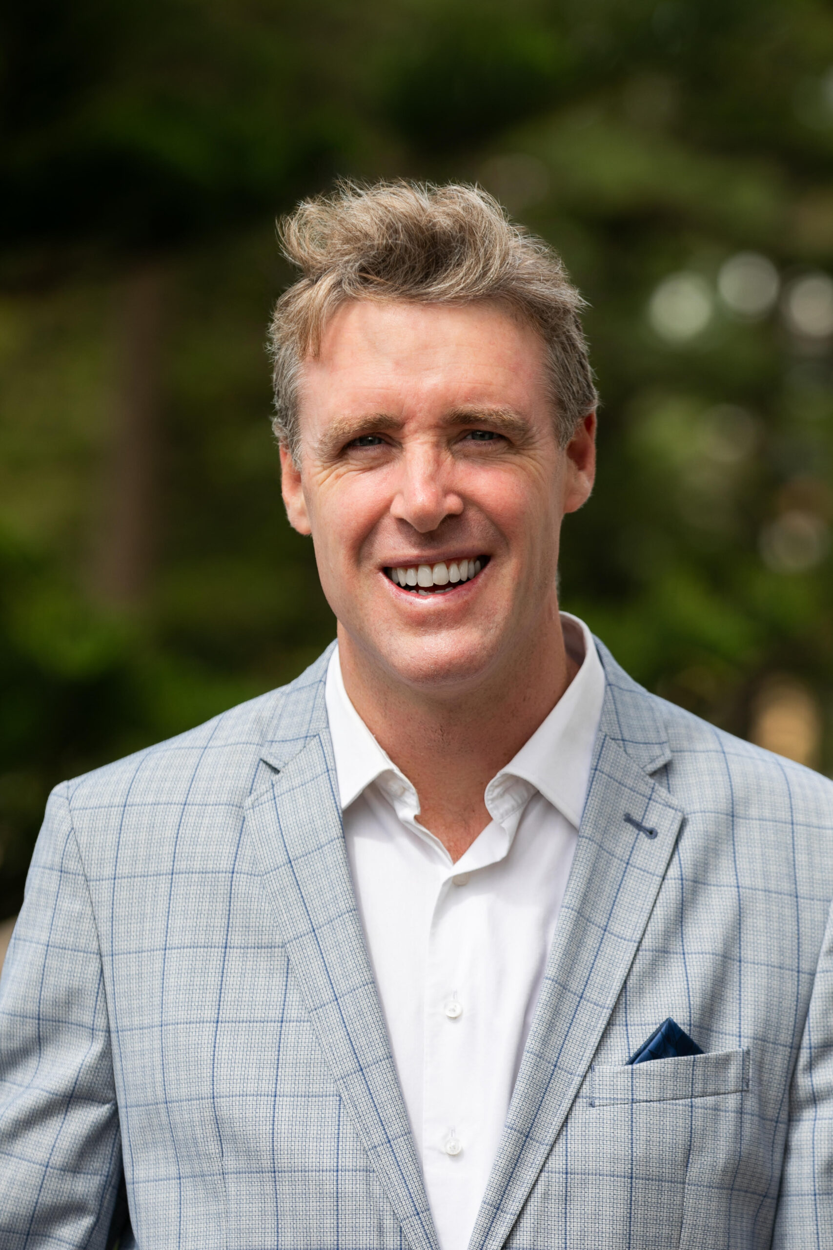 Dr James Forbes, Pain Medicine Specialist and Anaesthetist, standing at South Steyne Medical Centre.