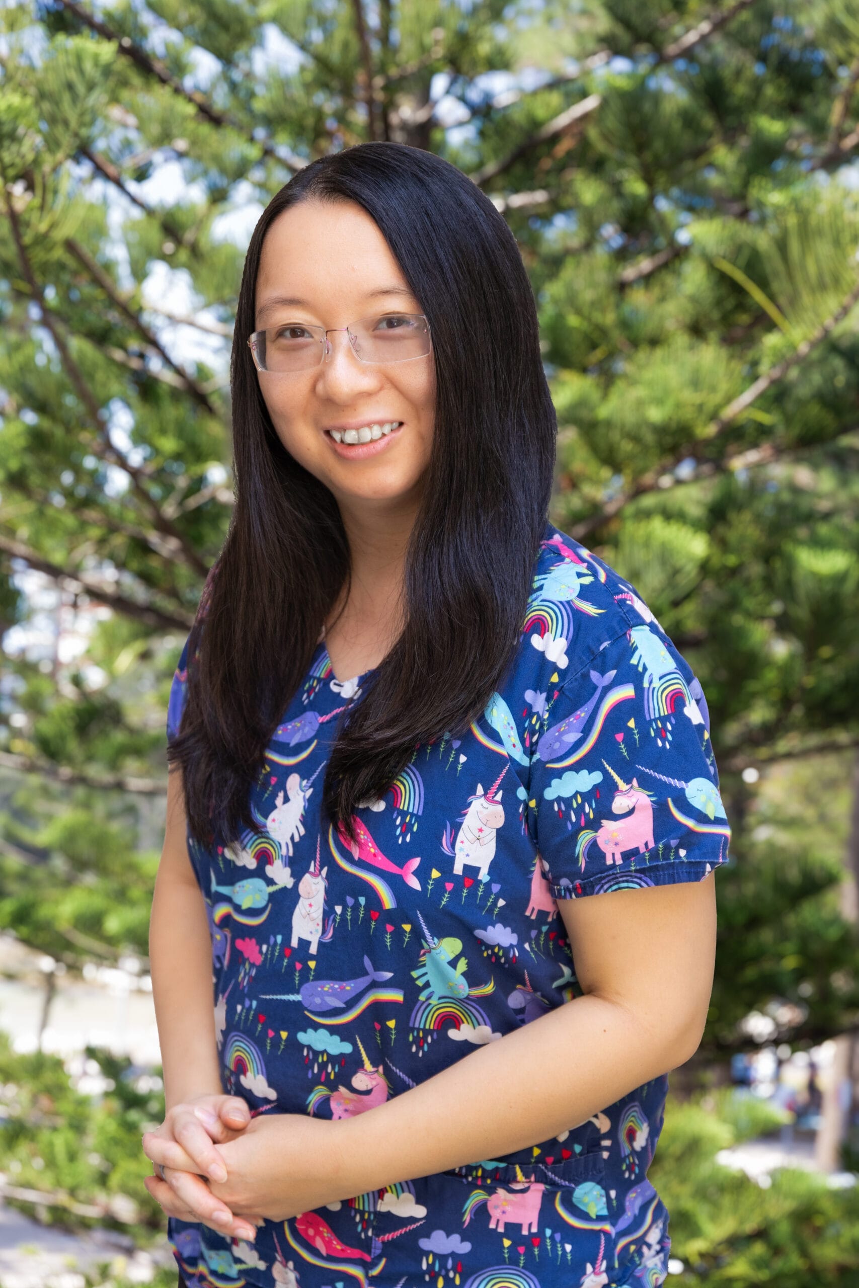 Dr Mindy Da, General Practitioner at South Steyne Medical Centre in Manly, smiling in her consultation room.